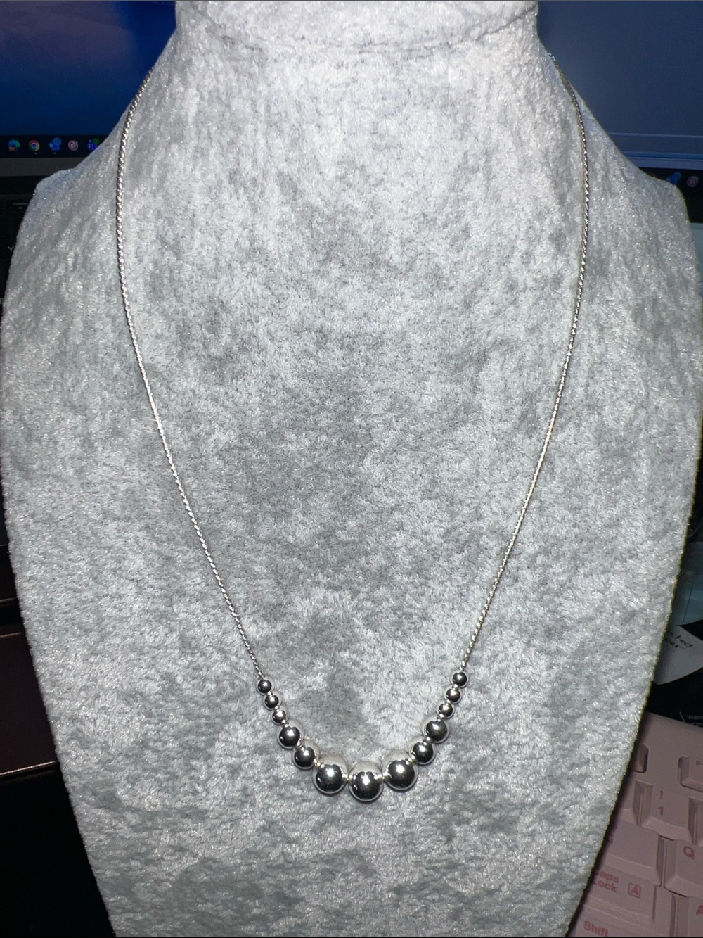 Polished Silver Graduated Bead Necklace